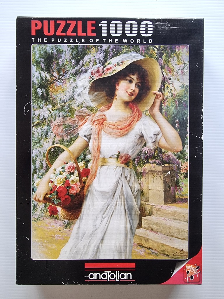 An oil painting of a young woman in a large sun hat carrying a basket of roses in a lush garden setting.