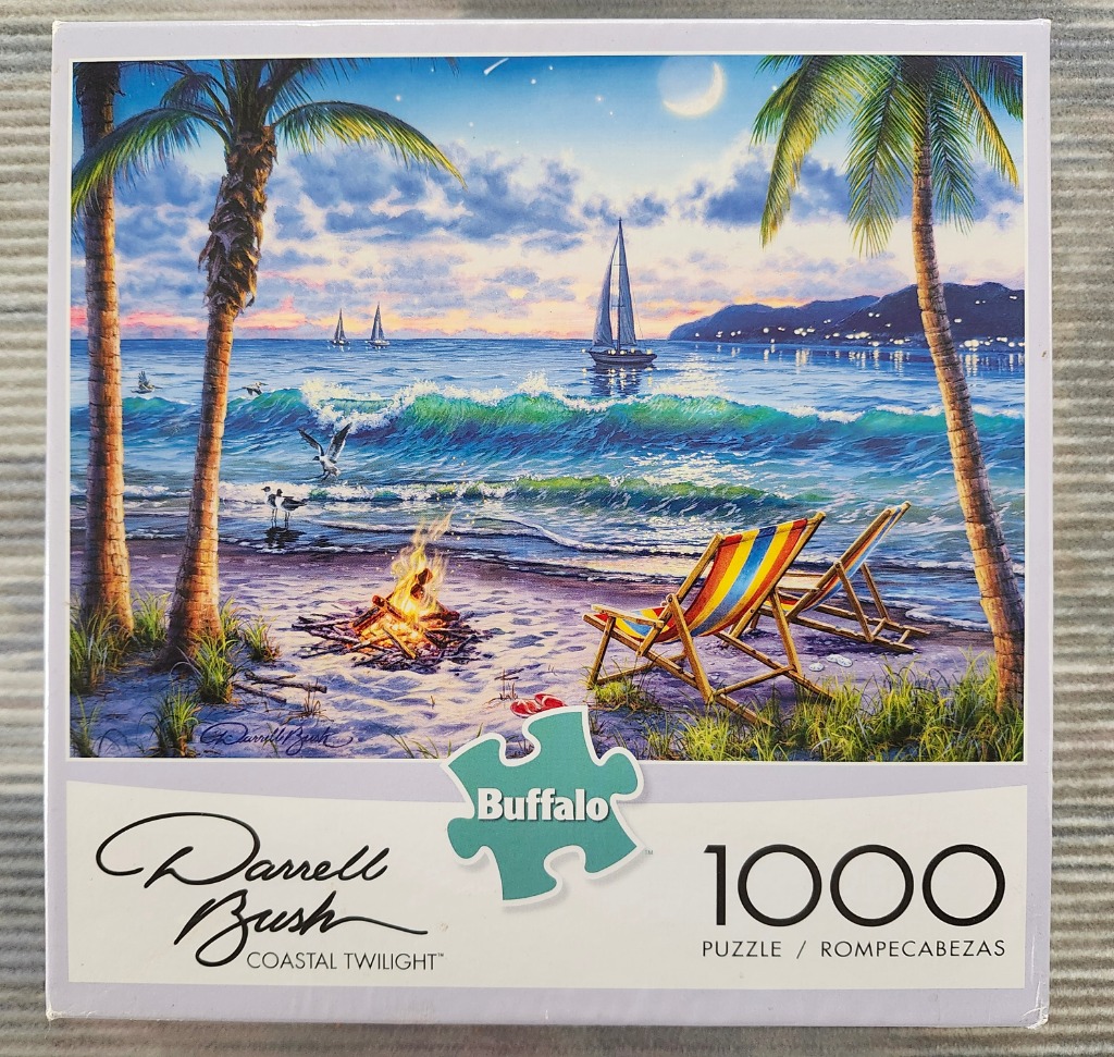 Tropical beach scene at twilight with a campfire, two striped deck chairs, palm trees, and sailboats on the ocean.