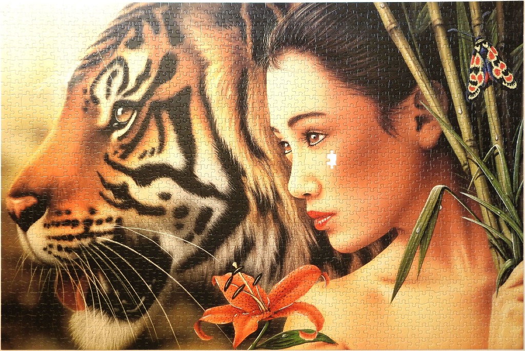 Close-up portrait of a woman next to a tiger in a tropical jungle setting.