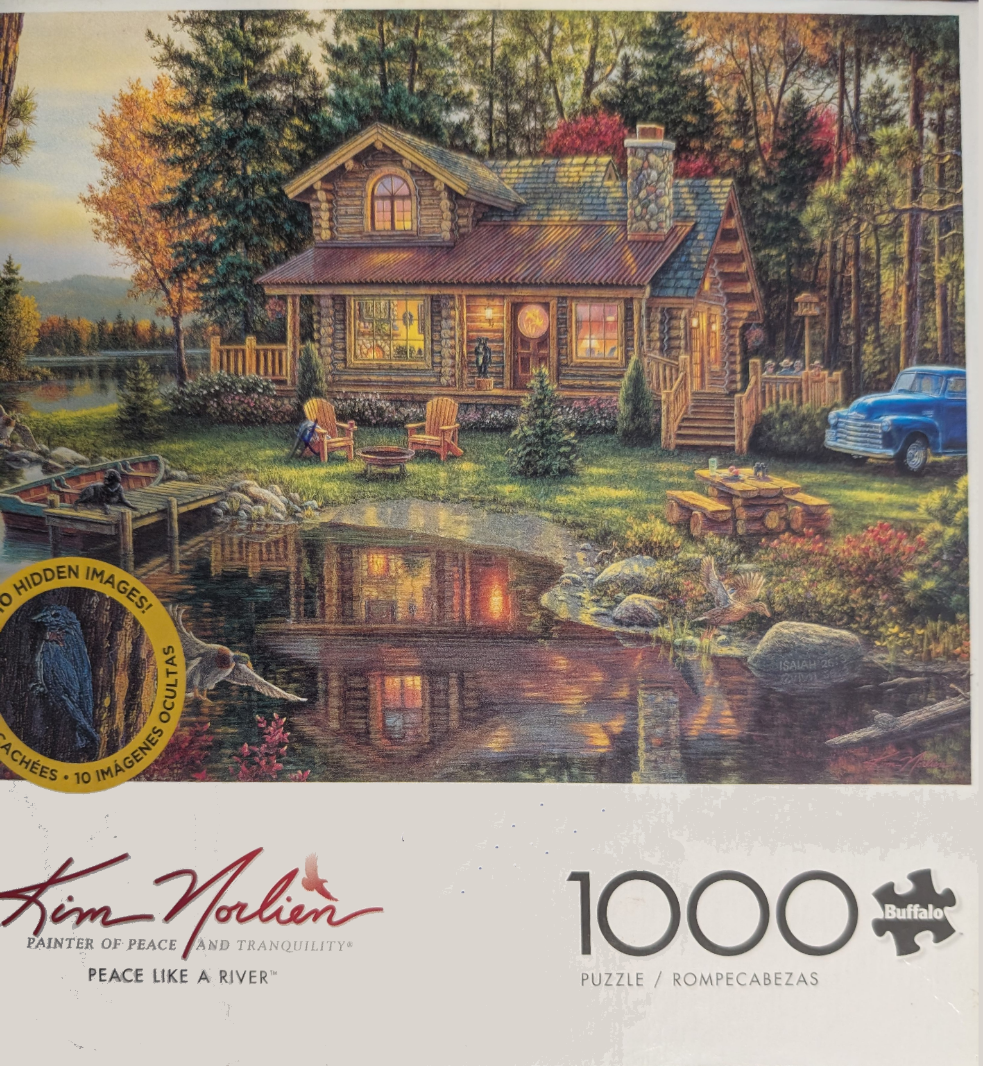 A cozy log cabin beside a reflective lake at dusk with a blue vintage truck, a wooden dock, and forest surroundings.