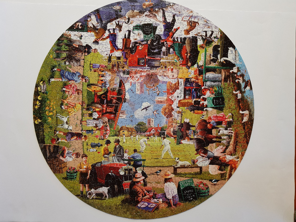 Circular illustration of a bustling 1950s British village green scene featuring vintage cars and people playing cricket.