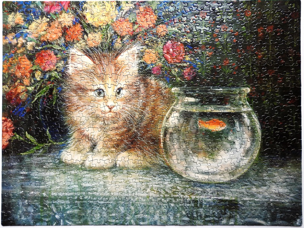 An oil painting of a fluffy ginger kitten sitting next to a goldfish bowl in front of a bouquet of flowers.