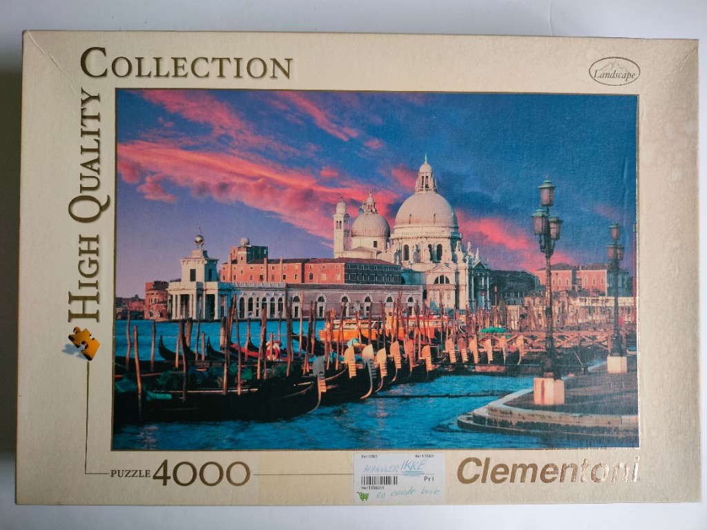 A Venetian scene showing the Basilica di Santa Maria della Salute at sunset with gondolas in the foreground.