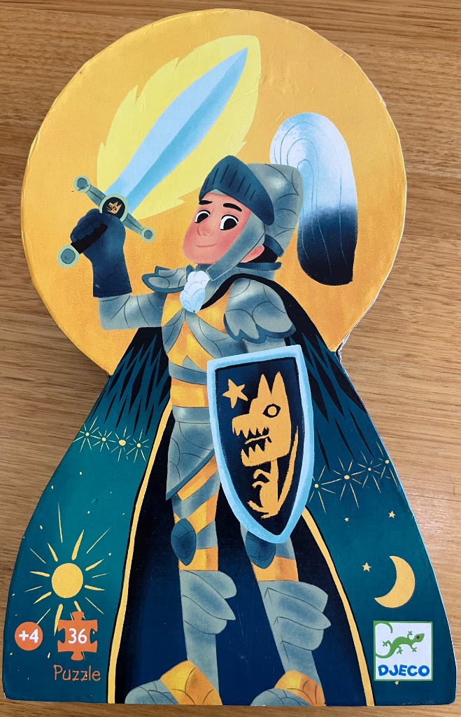 A whimsical illustration of a smiling medieval knight holding a glowing sword against a golden sun backdrop.