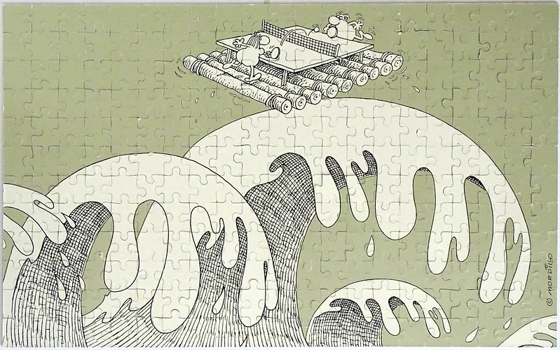 Cartoon illustration of two bulbous characters playing table tennis on a raft floating above turbulent ocean waves.