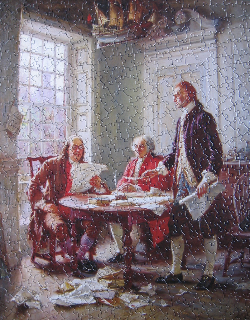 A painting of three men in colonial-era clothing reviewing documents at a table.