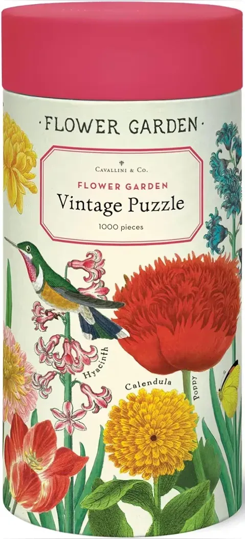 Vintage botanical illustration of various garden flowers and a hummingbird on a cream background.