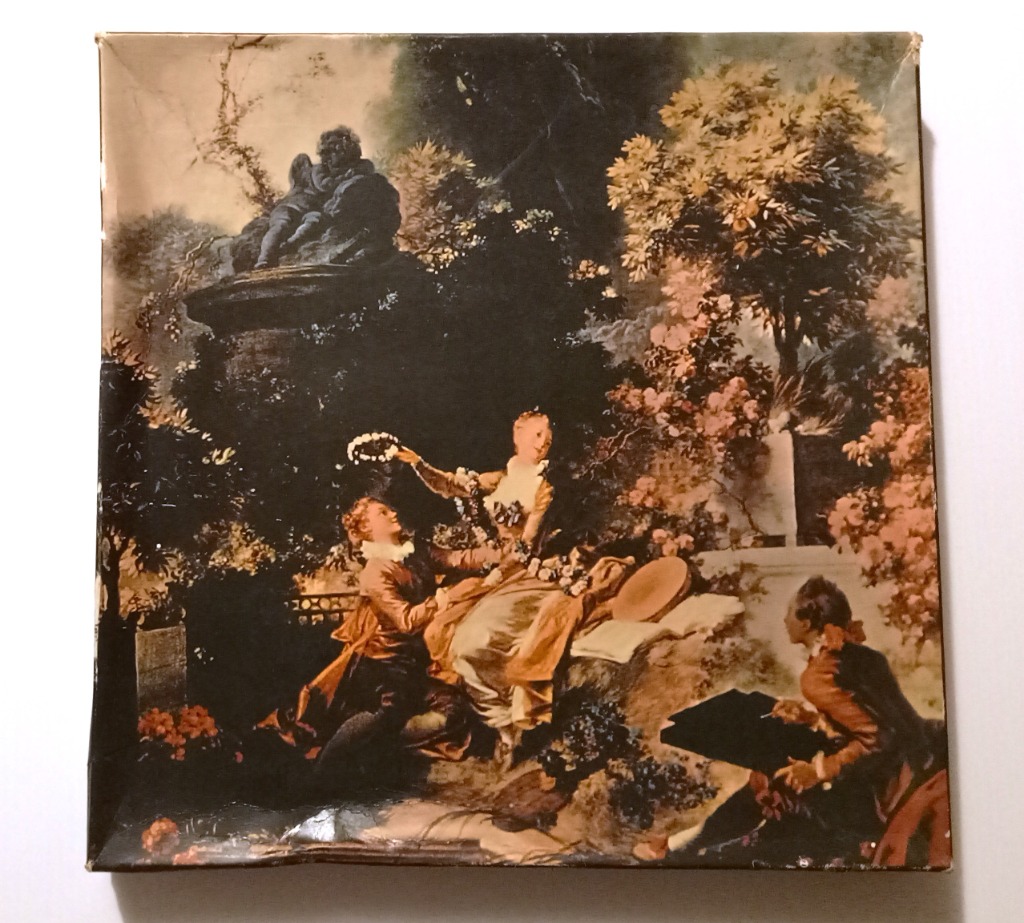 18th-century style painting of figures in a lush, romantic garden scene.