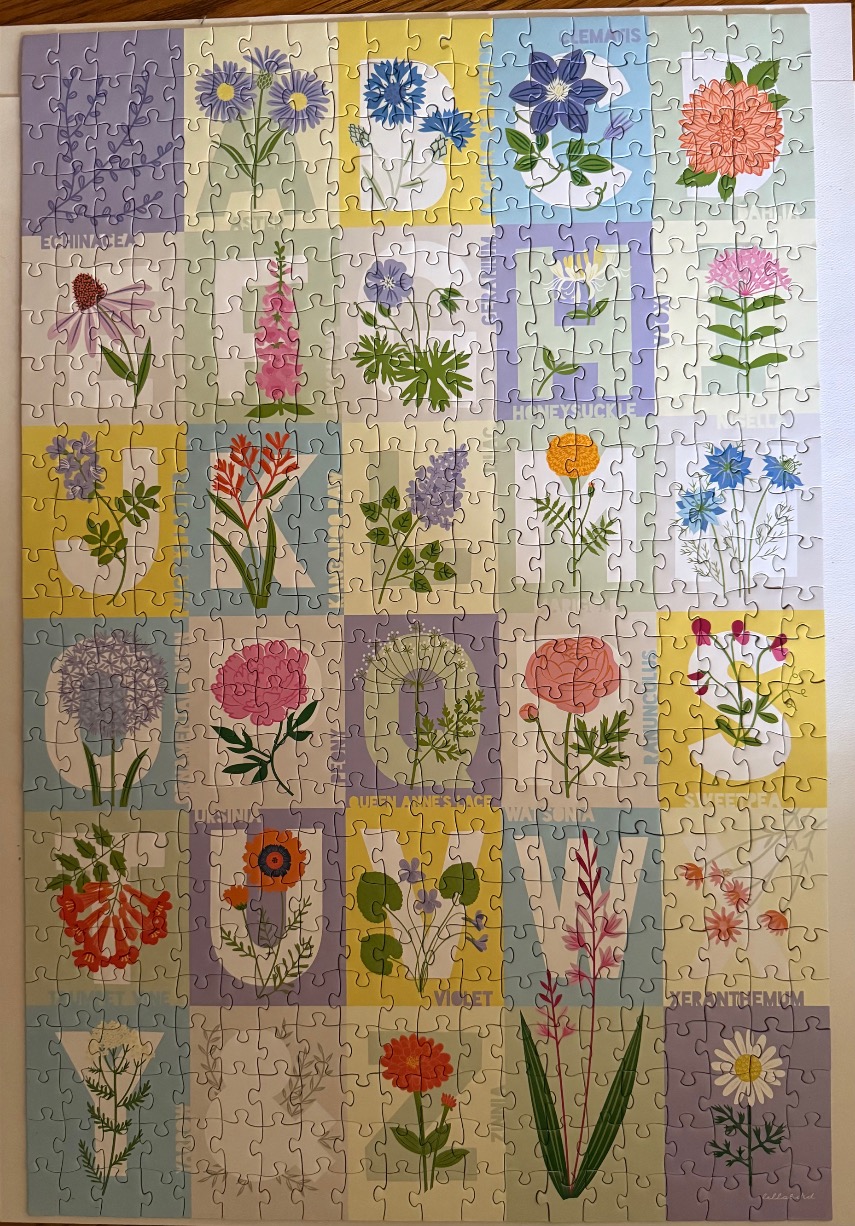 An alphabet-themed botanical illustration featuring a unique flower for each letter from A to Z.