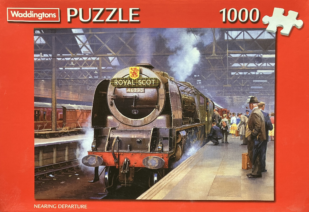 A steam locomotive engine stopped at a busy train station platform with passengers waiting.