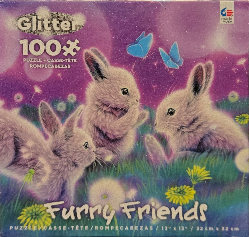 Three fluffy bunnies sitting in a grassy field with dandelions and blue butterflies against a purple glitter background.
