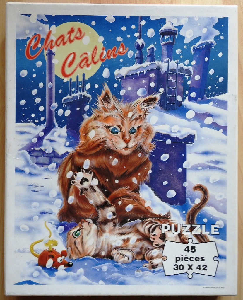 Two fluffy cats playing in the snow on a rooftop at night under a large yellow moon.