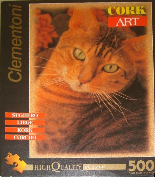 Close-up portrait of a ginger cat on a cork-textured background.