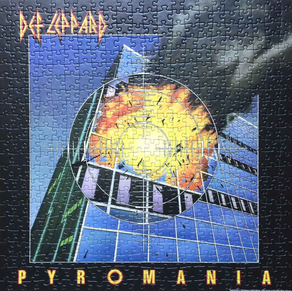 Def Leppard Pyromania album cover featuring a fiery explosion inside a building framed by a sniper scope.