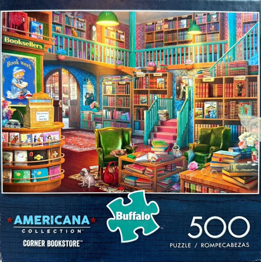 A cozy, multi-level bookstore interior filled with bookshelves, green armchairs, and a pug dog.