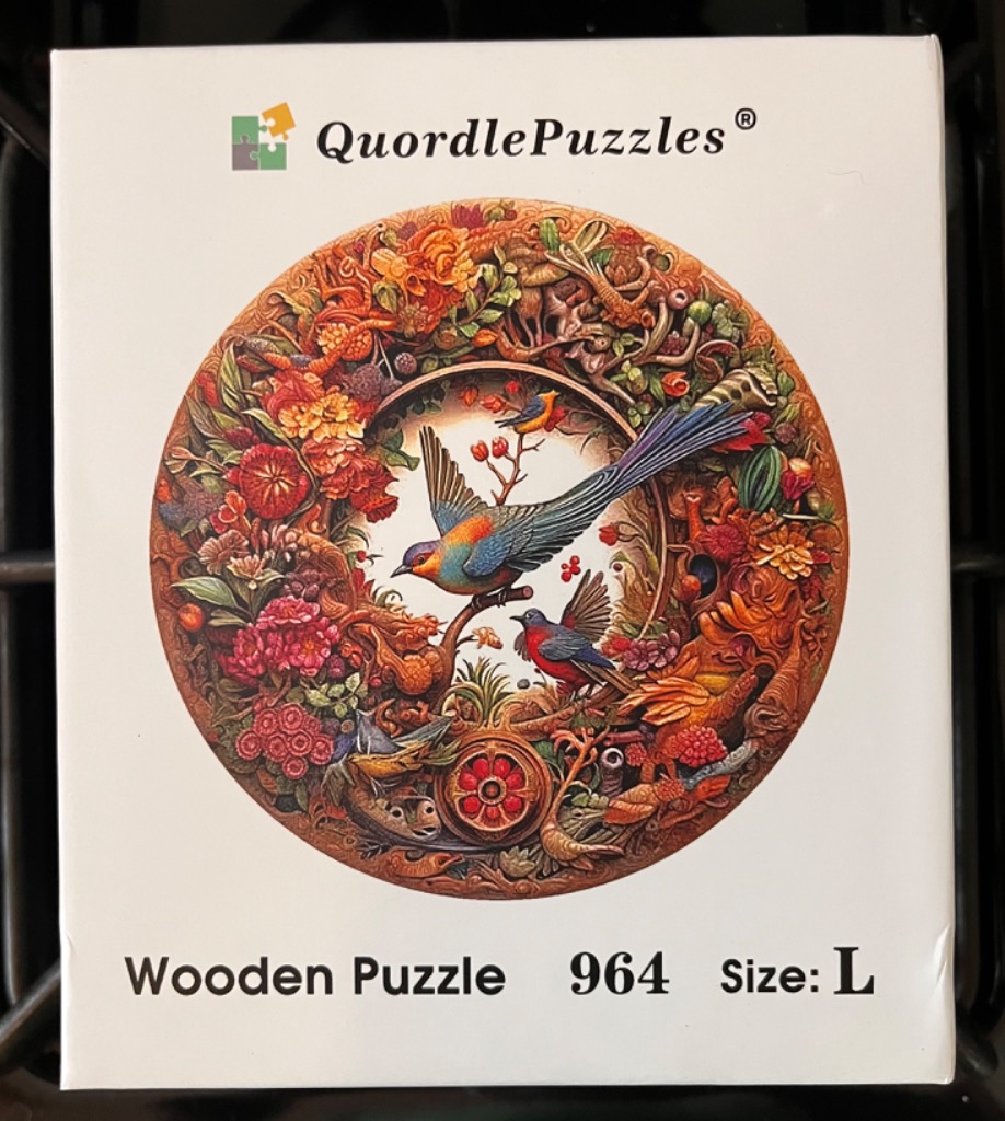 Circular illustration of colorful birds perched amidst dense autumn-toned flowers and foliage.