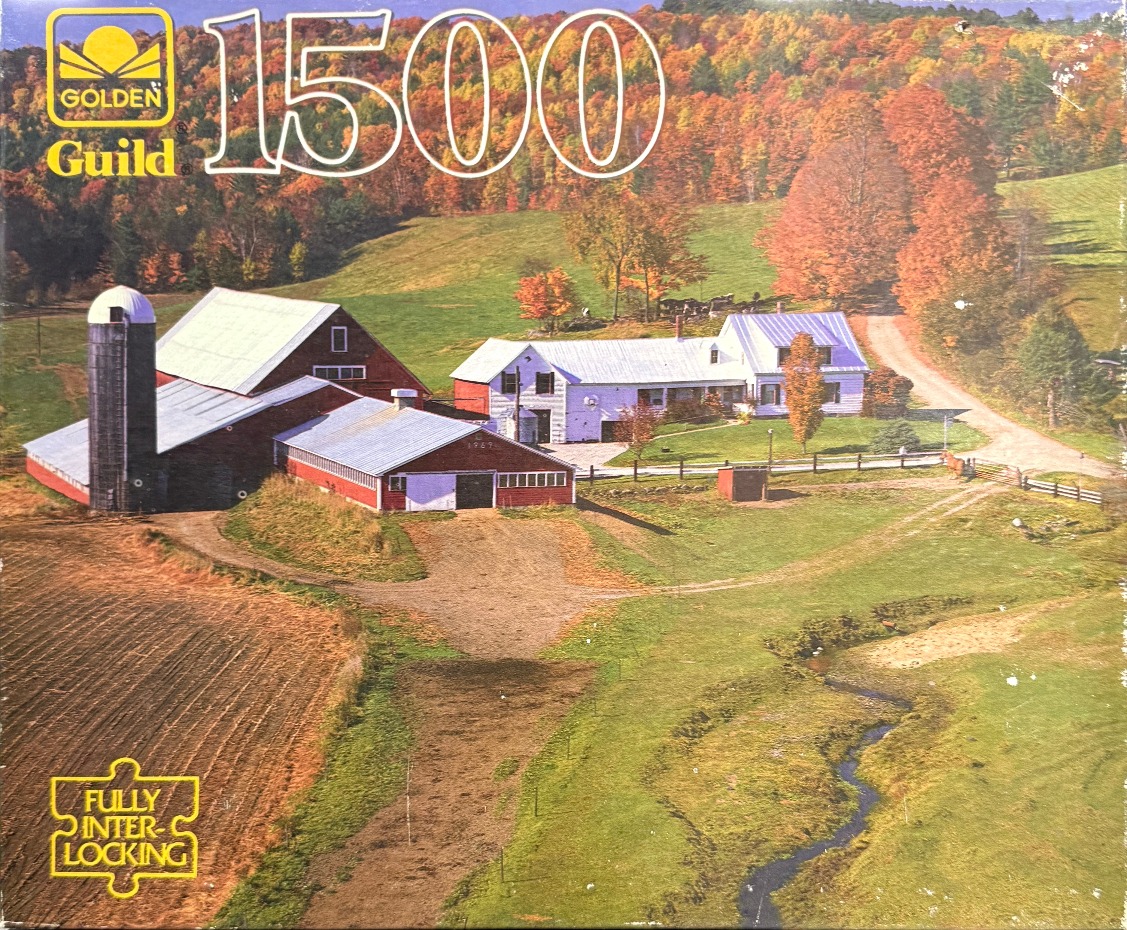 A rural farmhouse and barn complex nestled in a vibrant autumn landscape with a winding creek.
