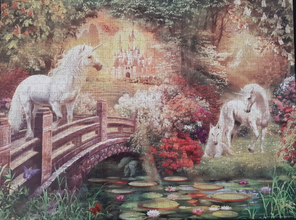 Two white unicorns in a magical garden setting with a castle in the background.