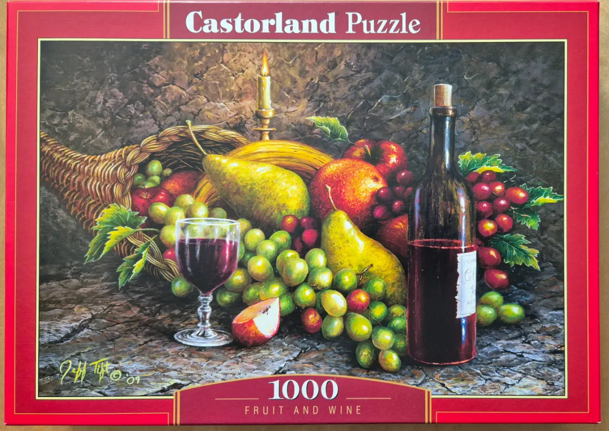 Still life painting of a cornucopia filled with fruit, a wine bottle, and a glass of red wine on a rustic table.