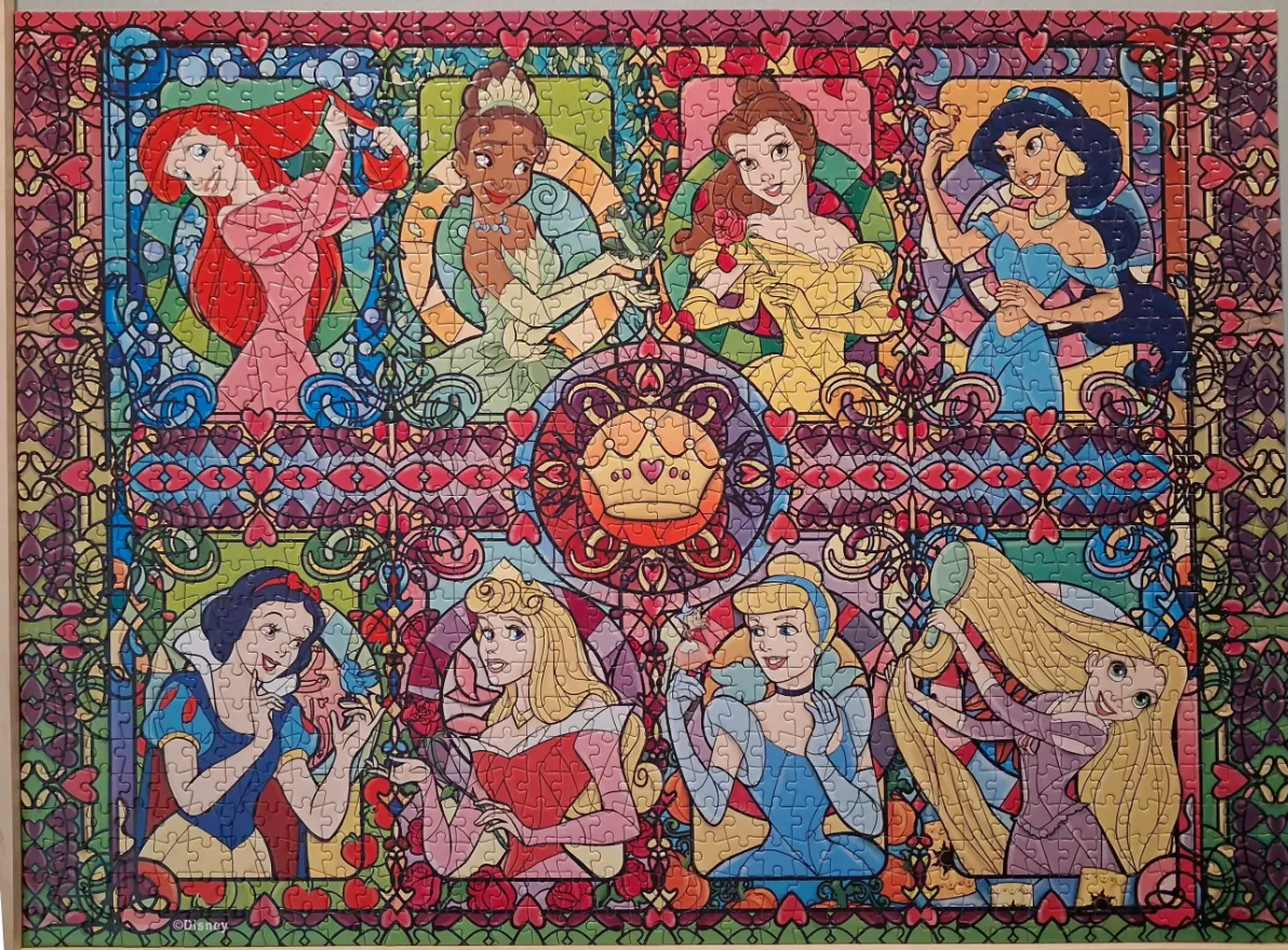 Stained glass style illustration featuring eight Disney princesses surrounding a central crown.