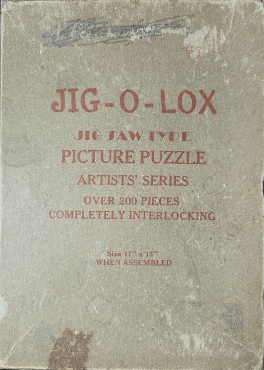 Vintage cardboard container with red printed text