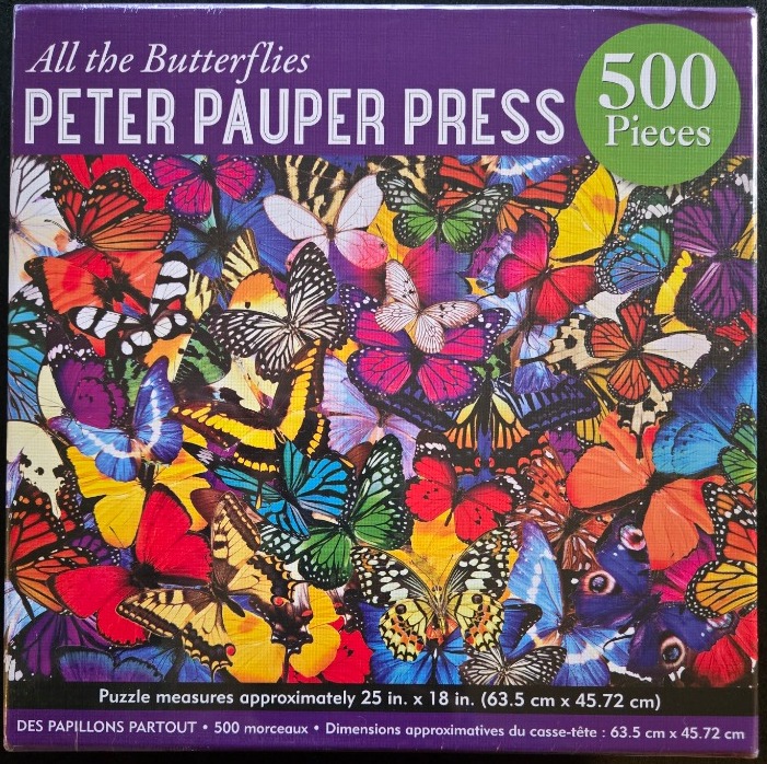 A dense, vibrant collage of various butterfly species in many different colors