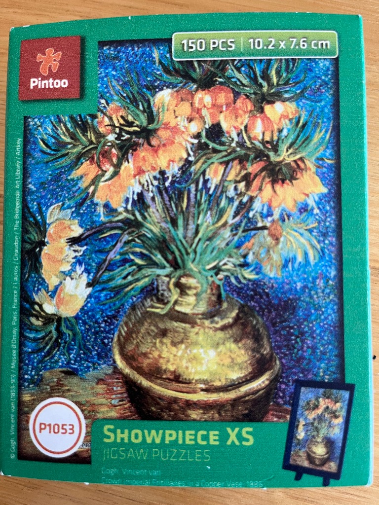 A Vincent van Gogh painting of crown imperial fritillaries in a copper vase against a stippled blue background.