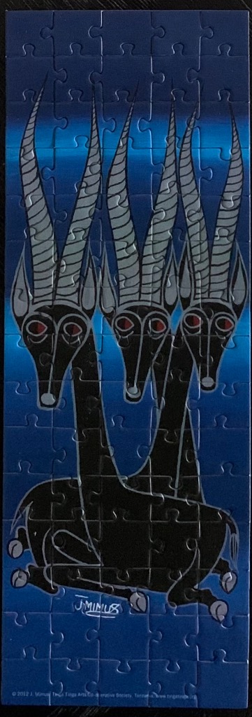 Tingatinga style painting of three black antelopes with long spiral horns against a blue gradient background.