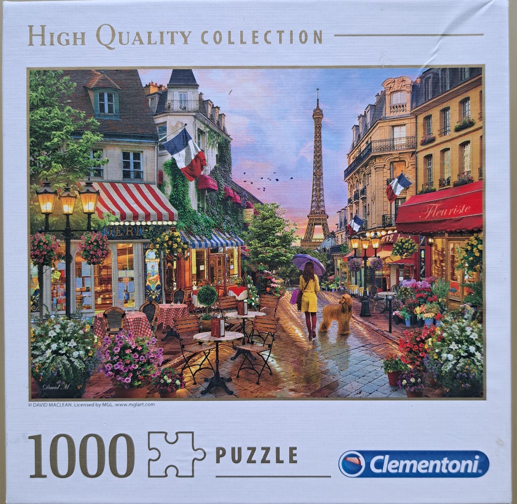 A woman with a purple umbrella and a dog walking down a rainy Parisian street with the Eiffel Tower in the distance.