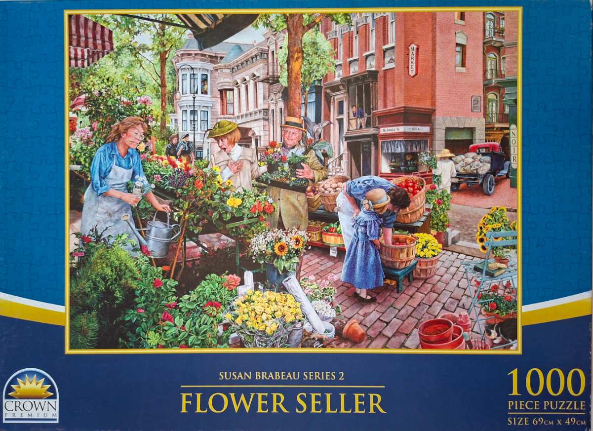 An outdoor city flower market scene with people shopping and a brick building in the background.