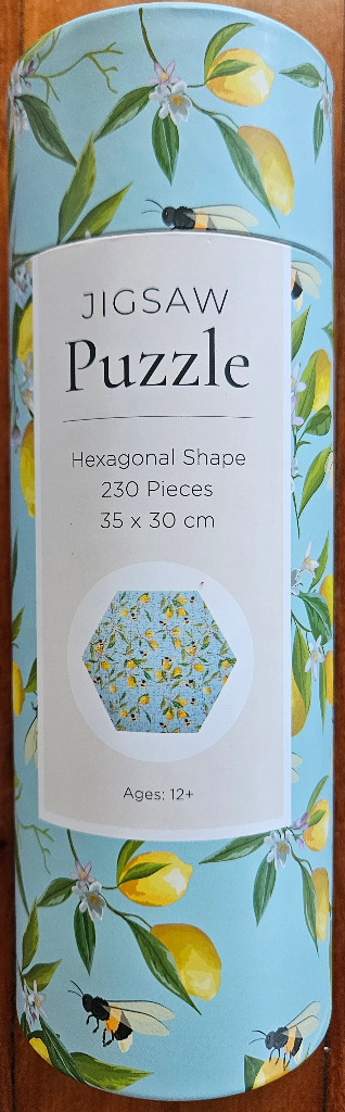 Pattern of lemons, white flowers, and bees on a light blue background.