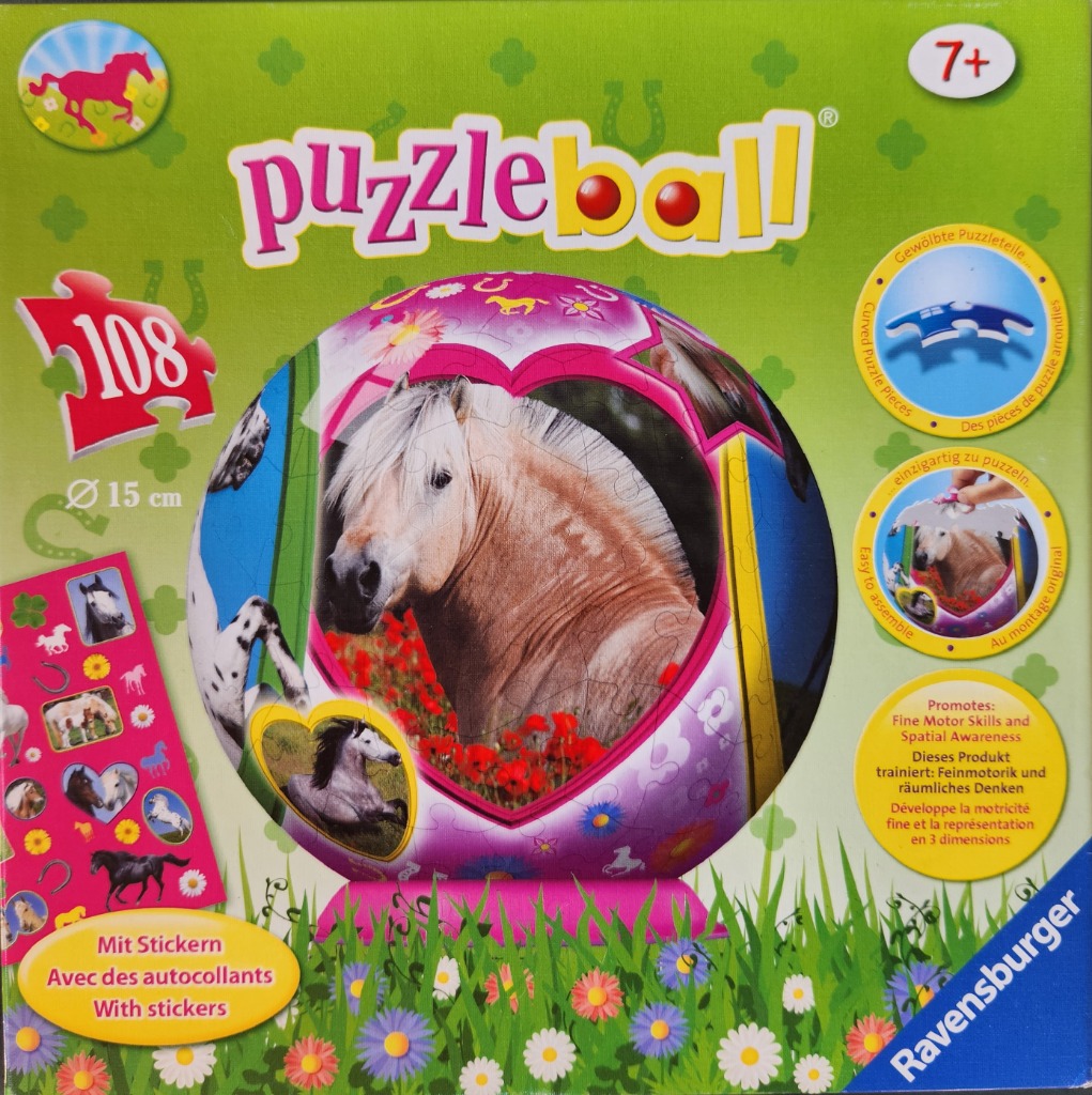 A spherical puzzle featuring a horse framed by a pink heart against a green meadow background.