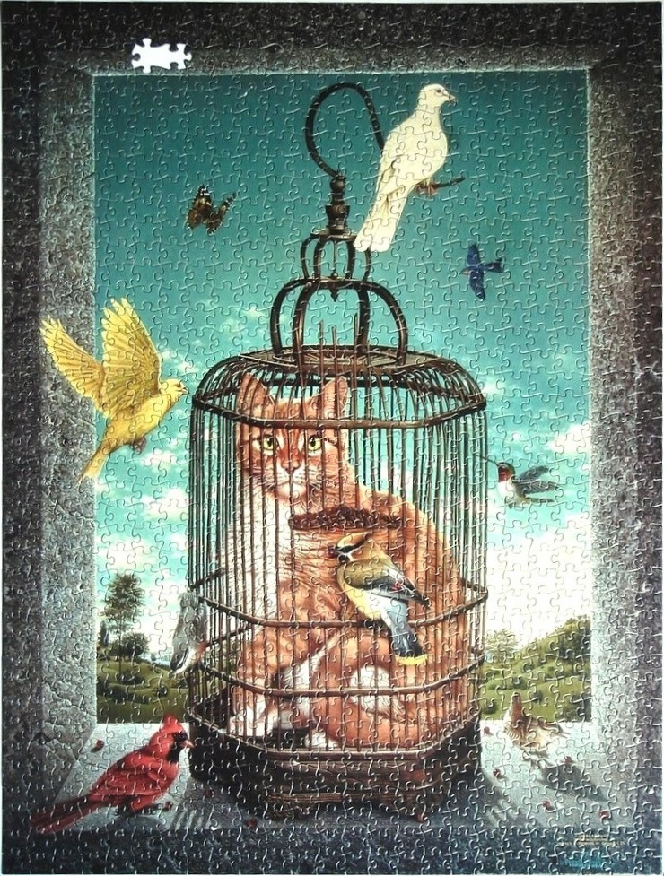 An orange cat sits inside a birdcage surrounded by various birds against an outdoor landscape background.