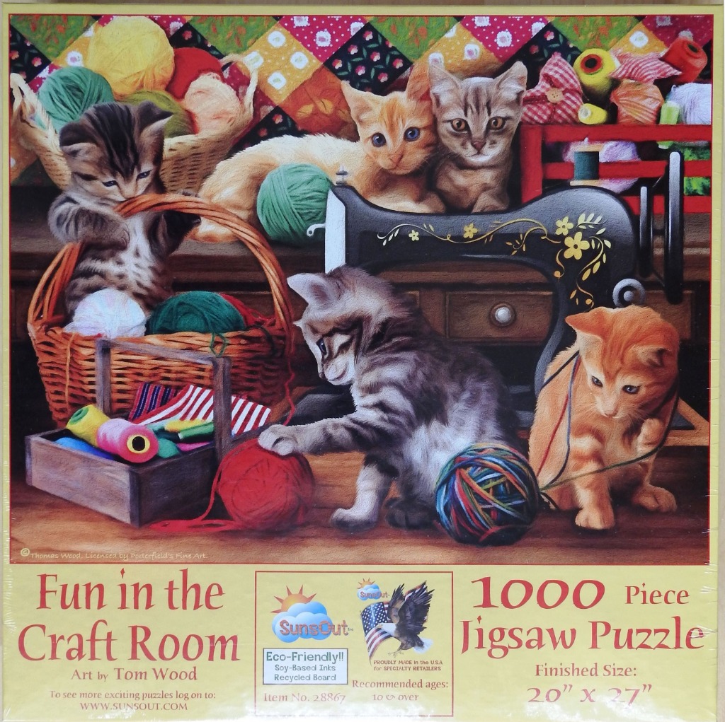 Five kittens playing with sewing supplies and yarn in a craft room.