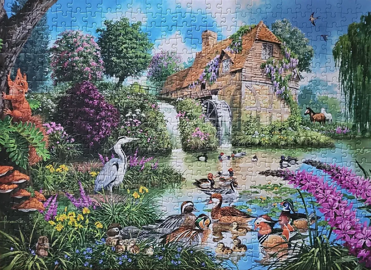 A scenic illustration of a rustic watermill by a pond populated with ducks, a heron, and surrounding garden wildlife.