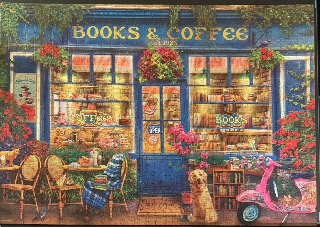 A cozy storefront called Books & Coffee with a golden retriever, a pink scooter, and floral decorations.
