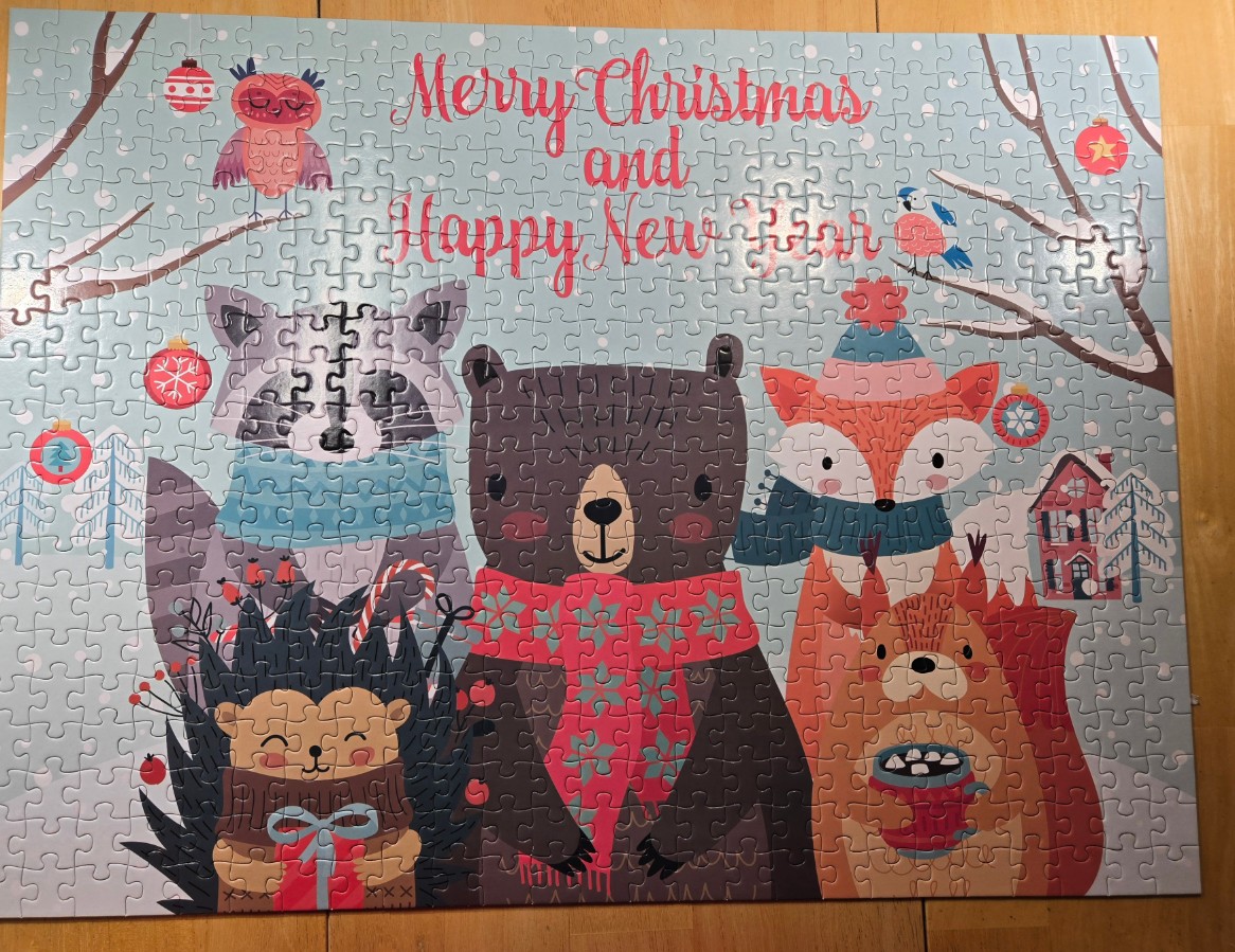 An illustration of woodland animals in winter attire with the text Merry Christmas and Happy New Year.