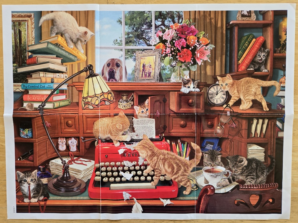Multiple kittens play around a bright red vintage typewriter in a cozy, book-filled study.