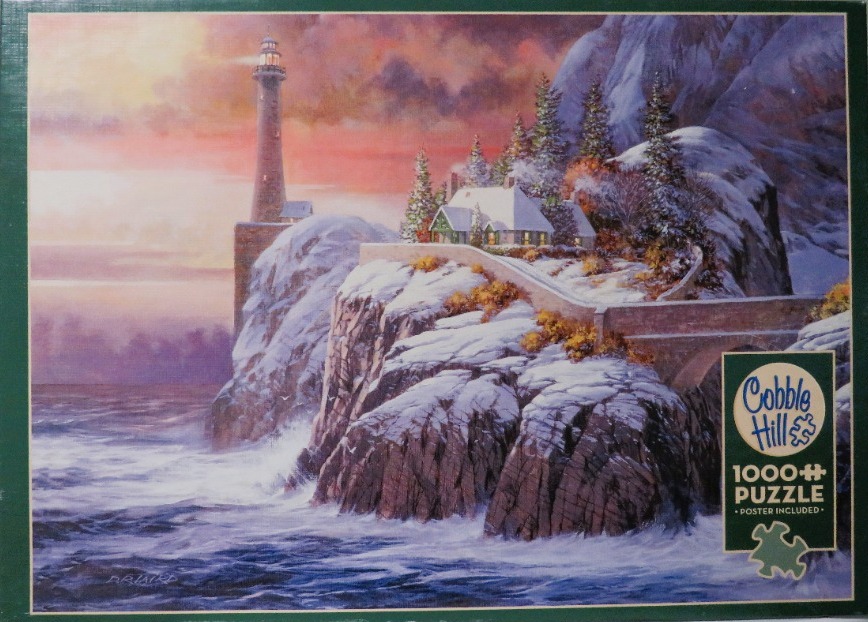 A lighthouse and cozy cottage on a snowy, rocky cliff overlooking the ocean at sunset.