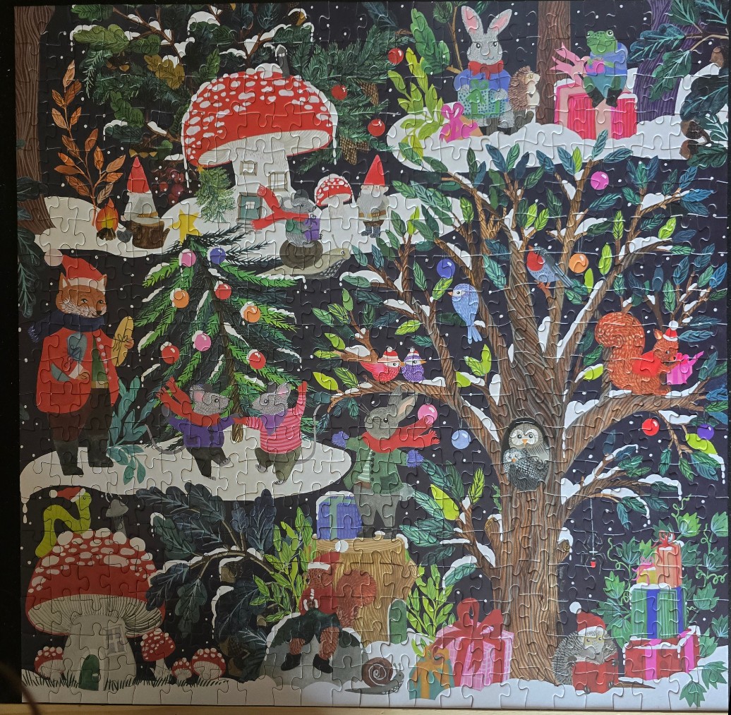 Whimsical illustration of forest animals celebrating Christmas in a snowy woodland scene