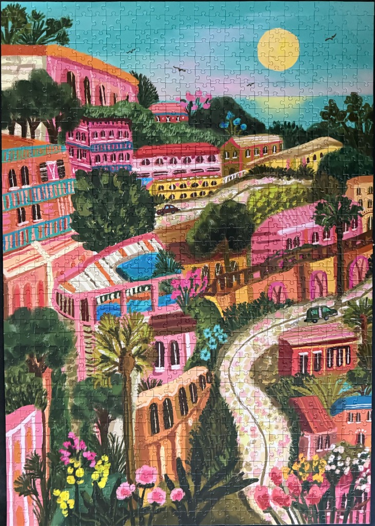 An illustration of a Mediterranean-style town with pink buildings, palm trees, and a winding road under a yellow sun.