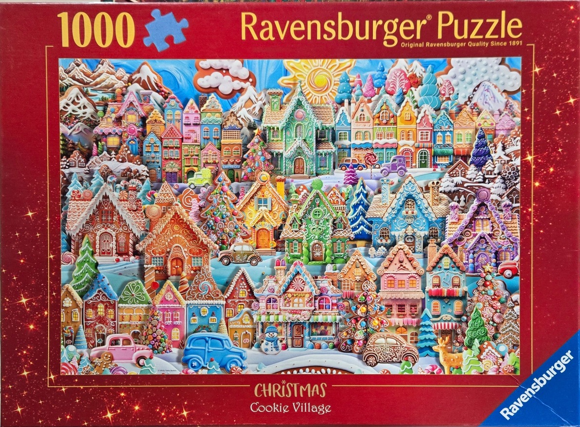 A festive illustration of a whimsical, colorful gingerbread village blanketed in snow under a sunny sky.