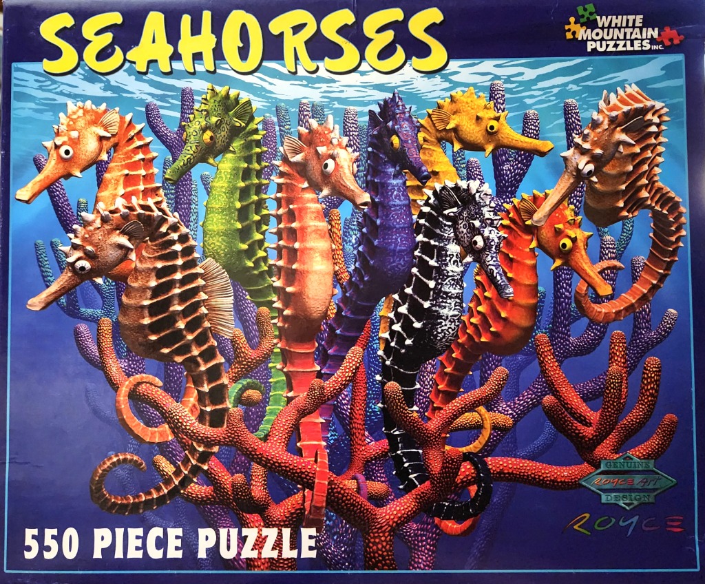 A collection of colorful seahorses swimming among bright coral reefs underwater.