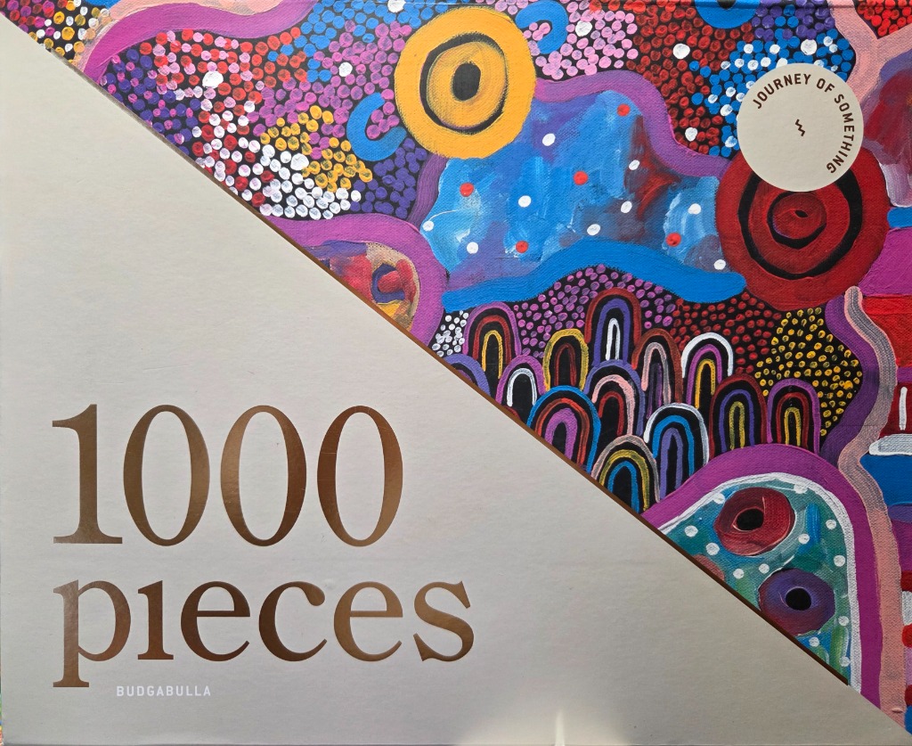 A diagonal composition featuring Indigenous Australian-style dot painting with vibrant geometric patterns.