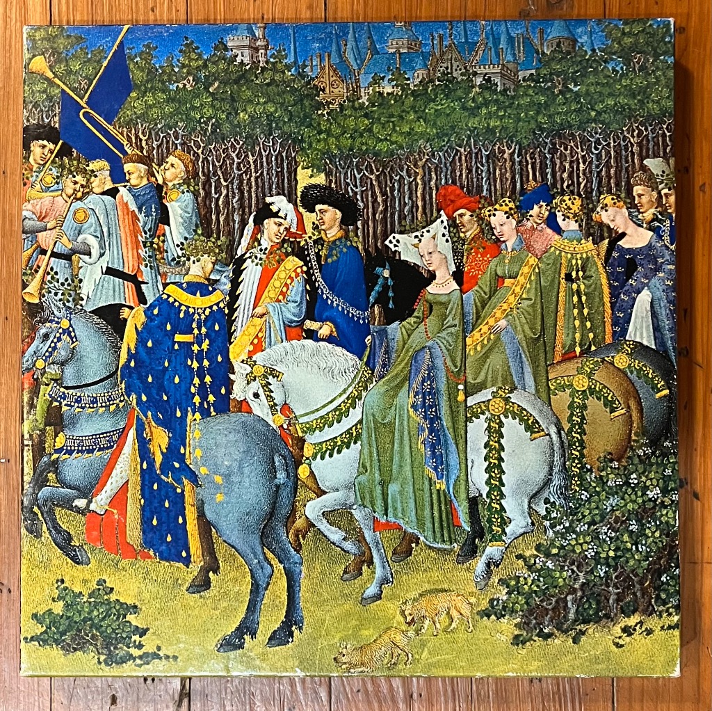 Medieval procession of nobles on horseback in front of a forest and castle