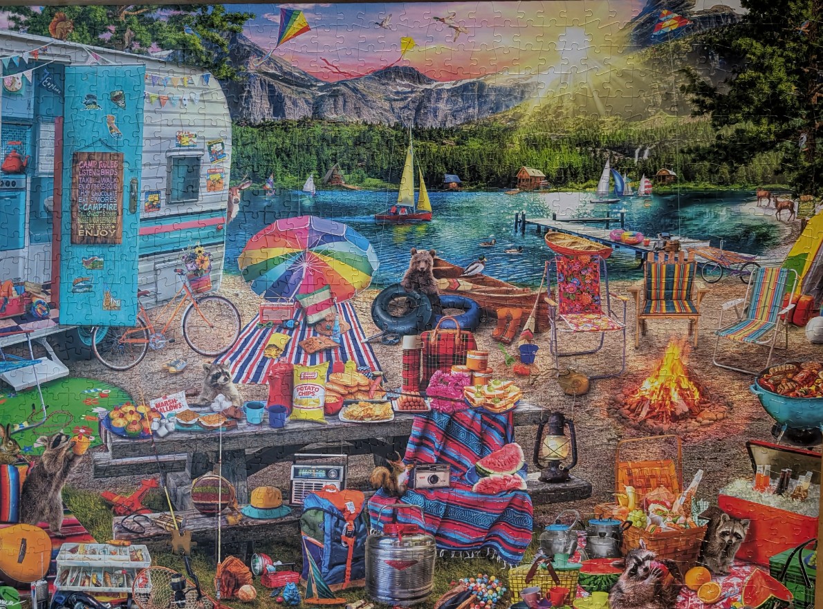 An outdoor lakeside scene featuring a vintage camper, a picnic setup, and friendly woodland animals.