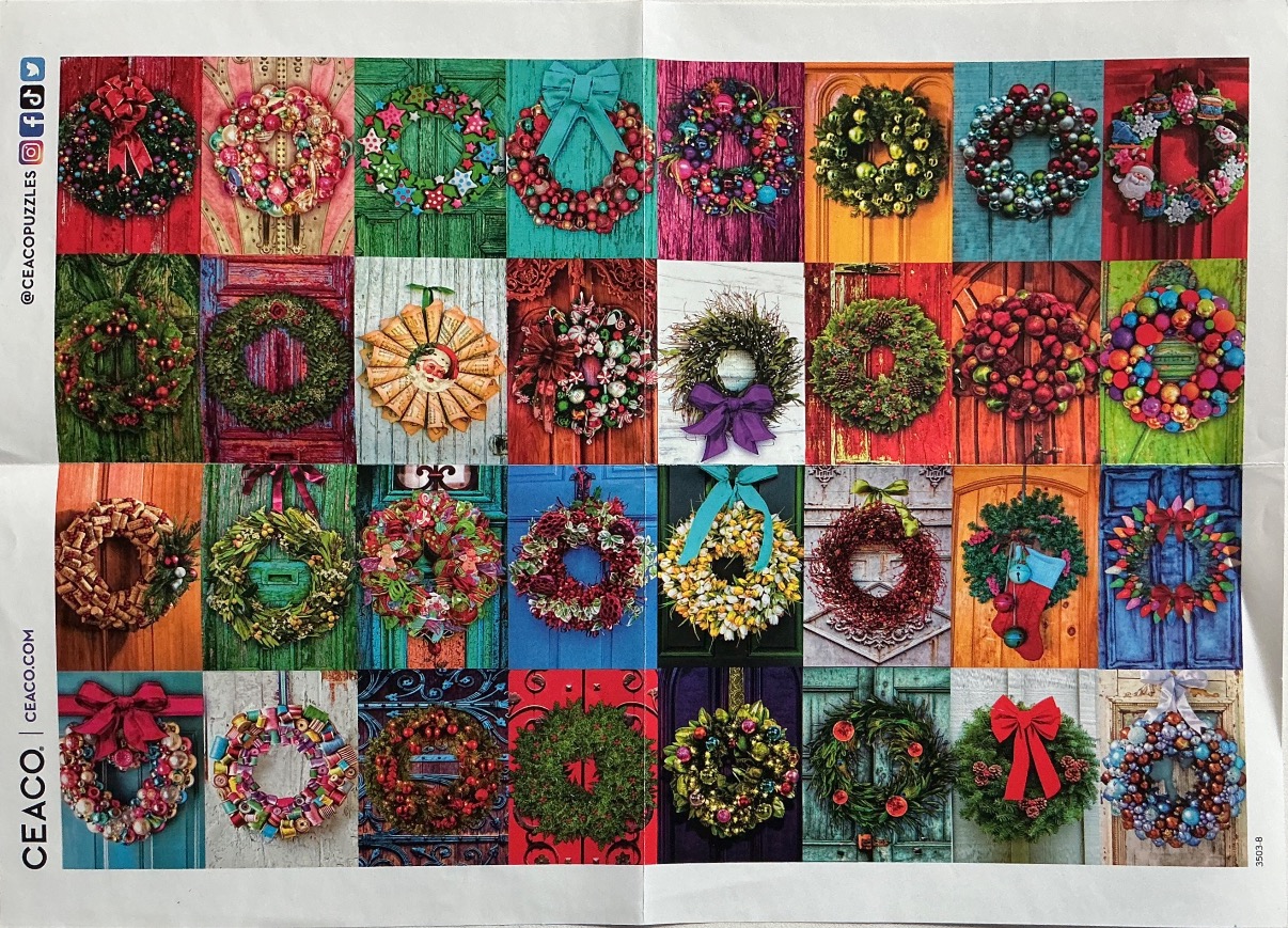 A collage of thirty-two colorful Christmas wreaths hanging on various rustic doors.