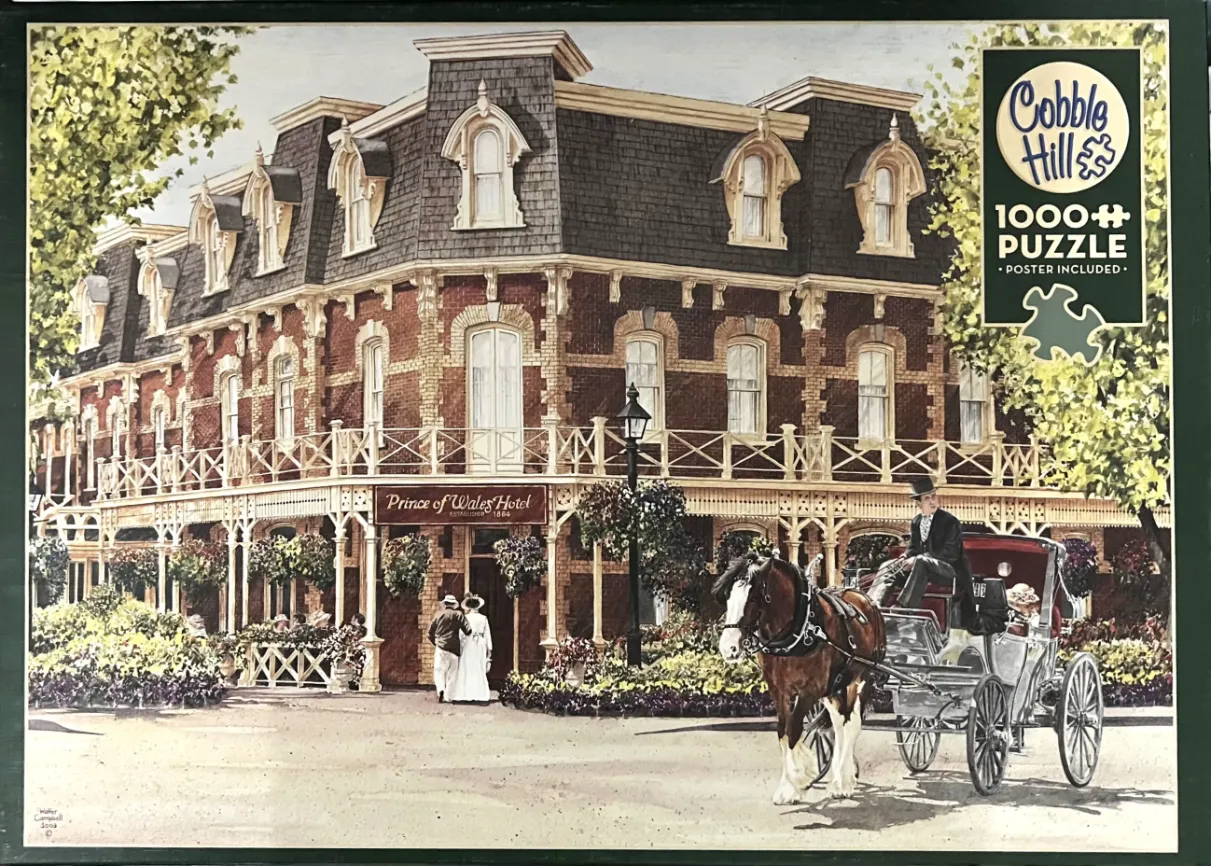 A Victorian brick hotel scene with a horse-drawn carriage in front.