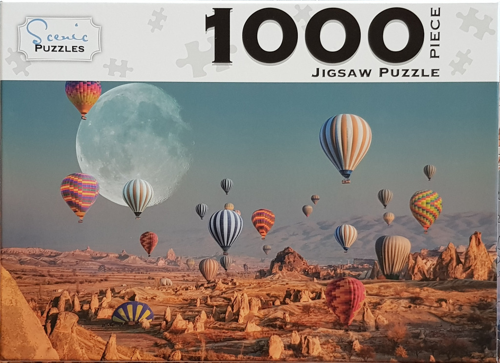 Many hot air balloons floating over a rocky landscape with a large moon in the background.