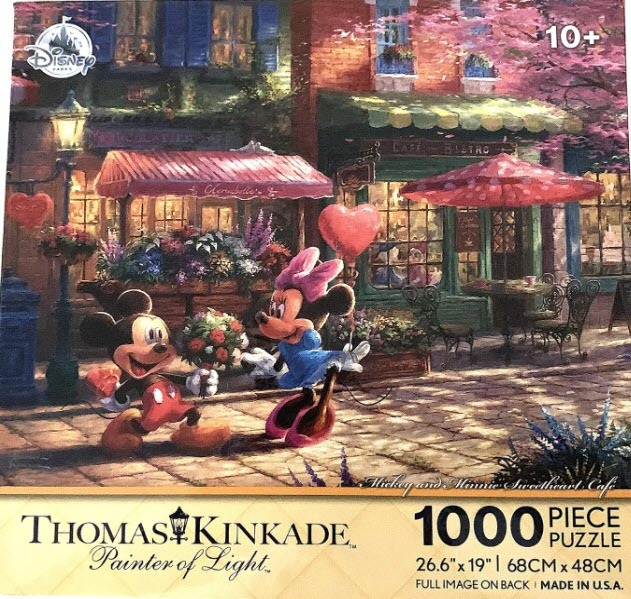 Mickey and Minnie Mouse sharing a romantic moment in front of a quaint European-style street cafe.